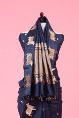 A dark grey Banarasi silk saree with Pichwai border for Navratri, Diwali, Durga Puja, and weddings, displayed on a mannequin. 