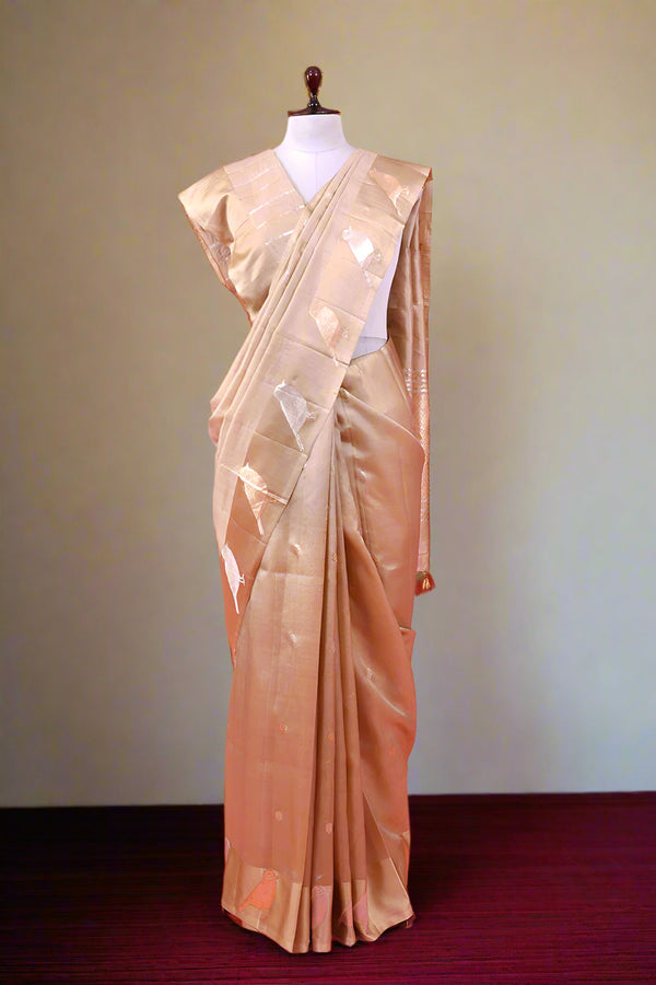 Beige saree with a blouse on a mannequin draped like Nita Ambani Wedding look