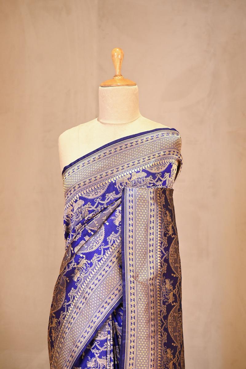 A shikargh purple Banarasi silk saree on dummy