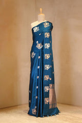 A blue Banarasi silk saree with zari motifs on dummy