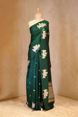 A Green Banarasi Silk Saree with Pichwai Cow woven Border