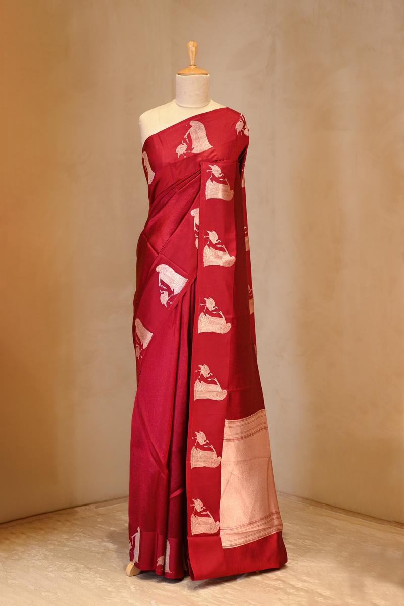 A red banarasi silk saree on dummy