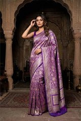 Purple and pink saree with a matching blouse on a wooden stand against a beige background