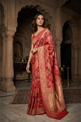 Woman wearing a Red Banarasi Saree with Rangkat & gold patterns in an Indian Heritage Setting