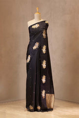 Black Puna Banarasi silk saree with gold floral buti, Vrishabha zari border and Bandhani Pichwai floral pallu