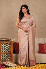 Women wearing of Mauve Semi Soft Silk Saree showing silver zari floral jaal and floral border details.