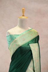Bottle Green Semi Satin Silk Saree with Contrast Light Green Floral Gold Zari Border
