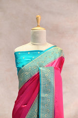 Pink Semi Satin Silk Saree with Contrast Sky Blue Floral Gold Zari Border