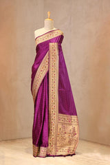 Close up of Purple Semi Satin Silk Saree showing gold zari woven polka butis and a Paithani-style Meenakari border.