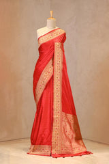 Close up of Red Semi Satin Silk Saree showing gold zari woven polka butis and a Paithani-style Meenakari border.