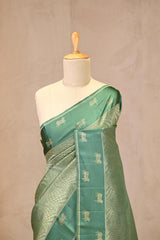 Rama Green Viscose Saree with Golden Wave Texture And Pichwai Border