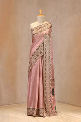 Close up of Pastel Pink Semi Tussar Silk Saree showing zari woven checkered pattern on the body and contrasting digital printed Ikkat border.