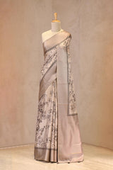 Close up of Grey Semi Tussar Silk Saree showing floral and Mayur digital prints, gold zari checkered border, and temple-inspired zig-zag printed borders.