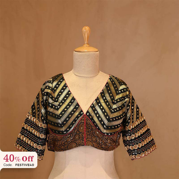 A designer silk blouse on a mannequin with a promotional text Diwali sale offer on blouses up to 50%