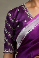 Nita Ambani wearing a purple Charbagh designer blouse with intricate embroidery