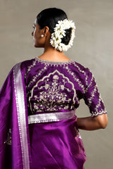 Nita Ambani wearing a purple Charbagh designer blouse with intricate embroidery