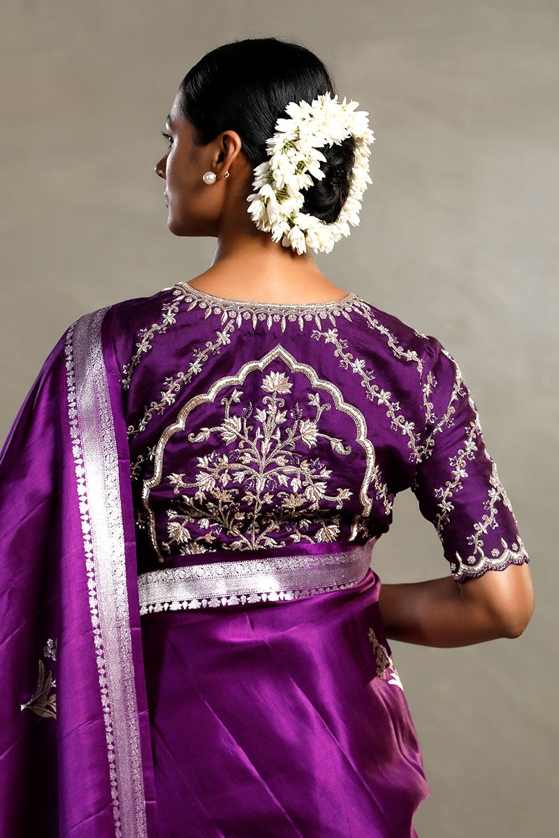 Nita Ambani wearing a purple Charbagh designer blouse with intricate embroidery