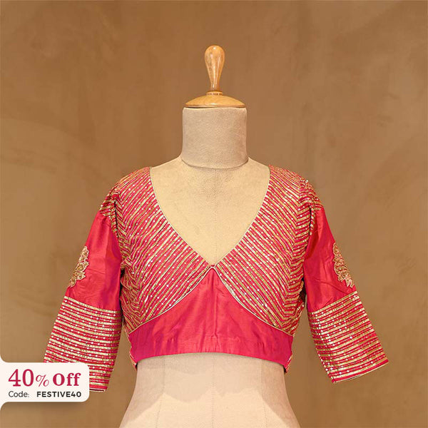 Pink blouse with gold embroidery on a mannequin with a promotional text Diwali sale offer on blouses up to 50%