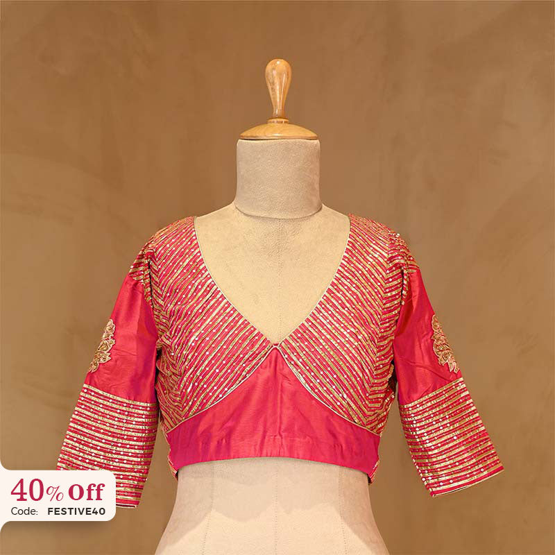 Pink blouse with gold embroidery on a mannequin with a promotional text Diwali sale offer on blouses up to 50%