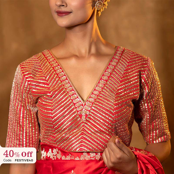 Red and gold embroidered blouse with a promotional text Diwali sale offer on blouses up to 50%