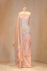 Peach unstitched suit set on a mannequin against a plain background