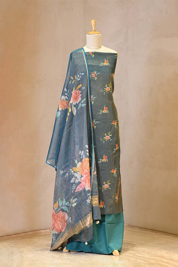 Traditional outfit with floral design on a mannequin against a neutral background