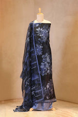 Blue floral patterned fabric draped over a mannequin against a beige background