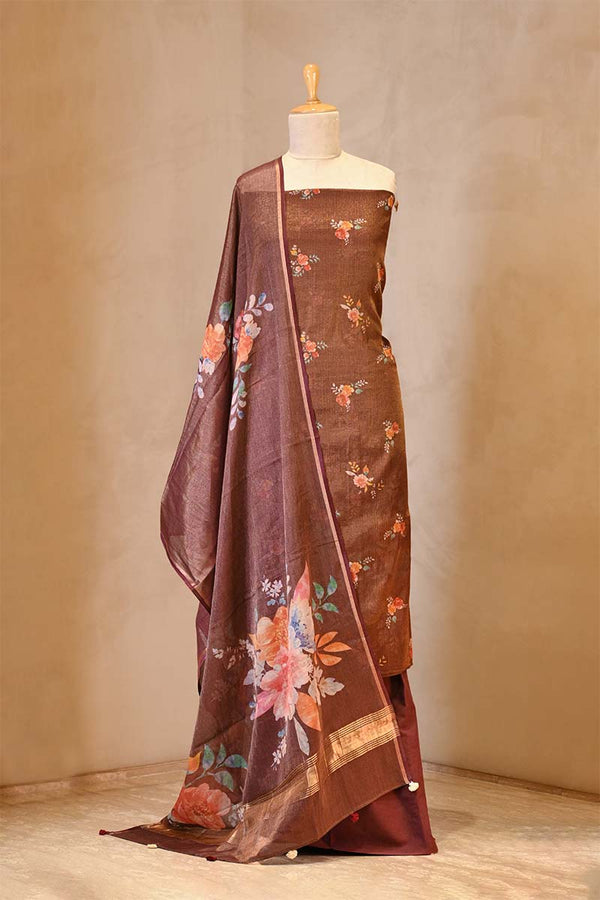 Brown suit set with floral patterns on a mannequin against a beige background