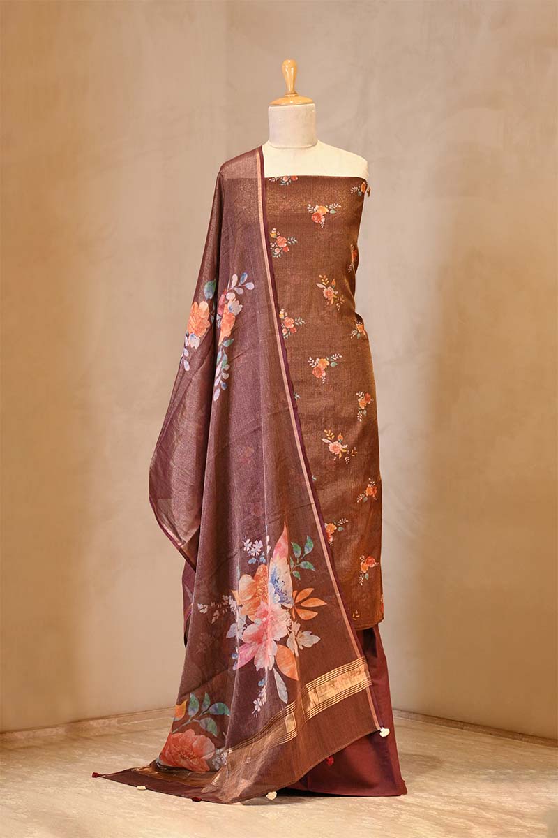 Brown suit set with floral patterns on a mannequin against a beige background