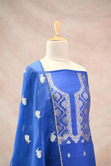 Katan Silk Unstitched Suit Set in Royal Blue with Silver Zari Floral Yoke and Matsya Motif Dupatta