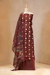 Maroon traditional outfit with floral patterns on a mannequin against a neutral background