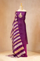 Purple saree with gold stripes on a mannequin against a neutral background