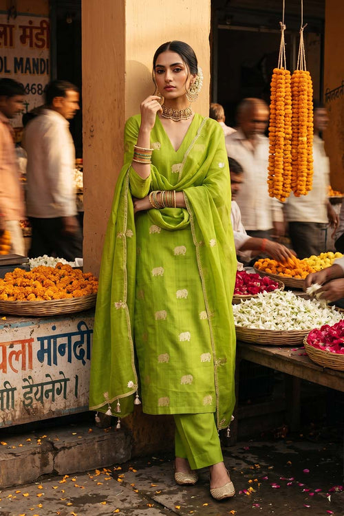 Close up of Green Chiniya Silk Suit Set showing the unstitched top fabric with Gaja motifs and the organza dupatta with gota patti and cutdana border.