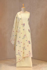 Multicolor cross-stitch embroidered floral butas on light yellow crushed cotton silk fabric with a scalloped mulmul cotton dupatta.