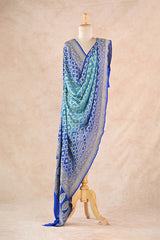 Blue Georgette Dupatta showing gold zari checks with floral buta detailing, authentic Bandhani texture, and intricate zari pallu.