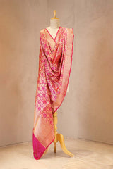 Pink patterned scarf on a mannequin against a beige background