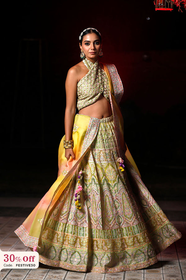 A bride in a traditional green and yellow Lehenga with a promotional text sale offer on Lehenga up to 50%