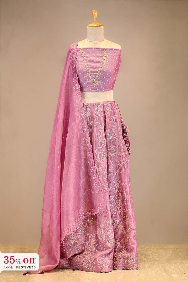 Pink embroidered Lehenga with a dupatta on a mannequin with a promotional text sale offer on Lehenga up to 50%