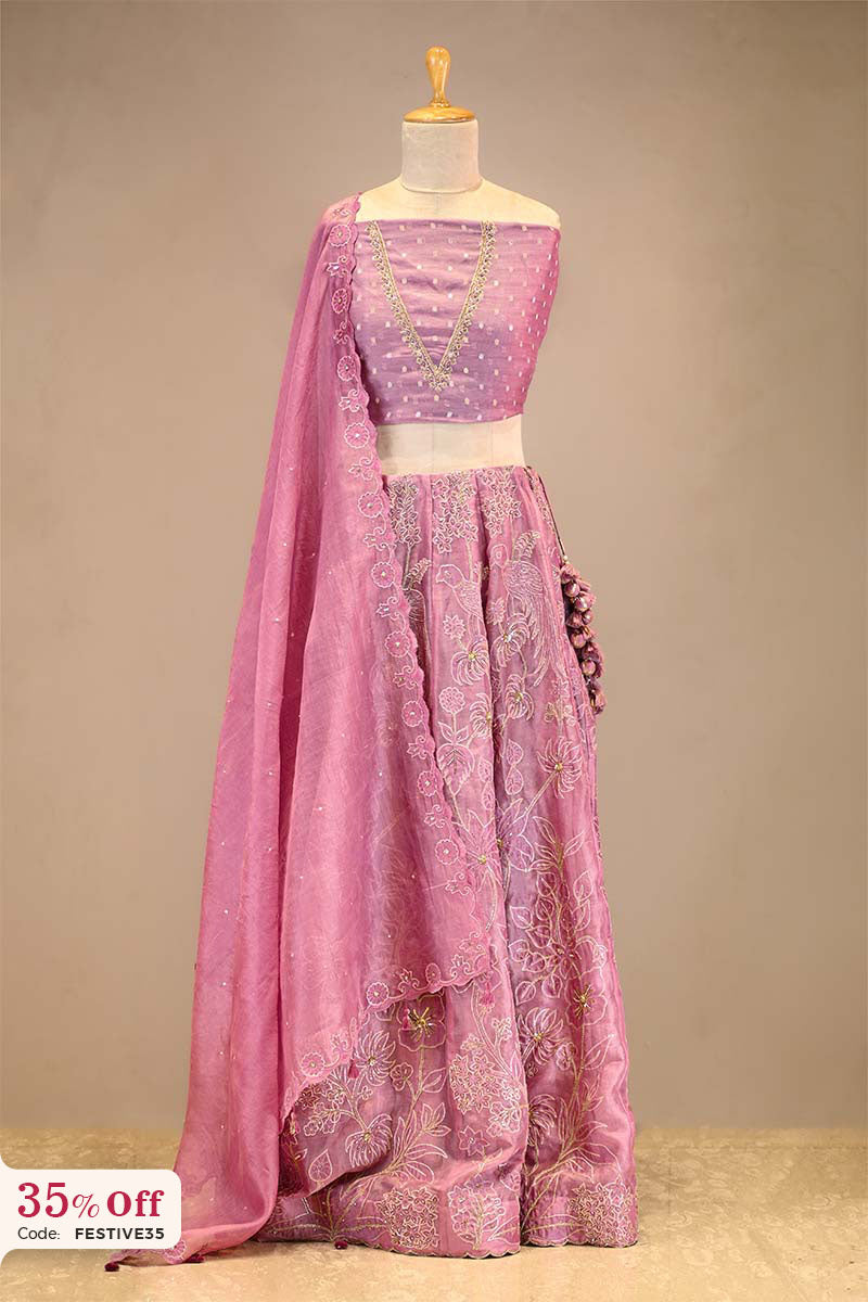 Pink embroidered Lehenga with a dupatta on a mannequin with a promotional text sale offer on Lehenga up to 50%