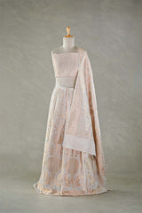 Mannequin wearing a light pink and white patterned outfit against a neutral background