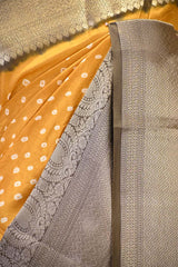 Yellow Chiniya Banarasi Silk Saree with Bandhni Buti & Silver Zari Border