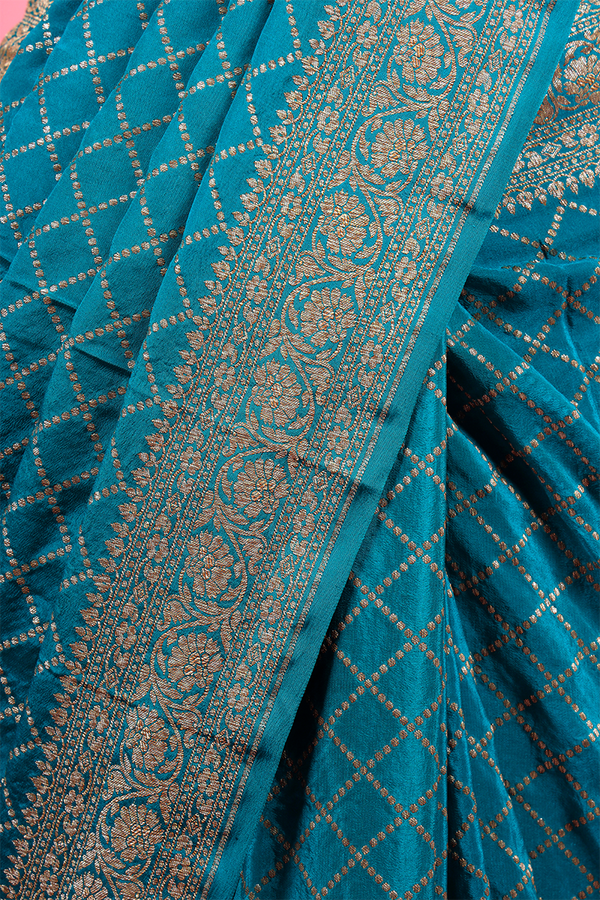 Teal Blue Geometrical Woven Crepe Khaddi Silk Saree