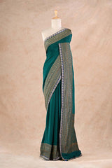 Bottle Green Crepe Silk Saree with Antique Zari Floral Border and Lace