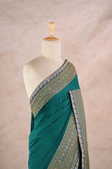 Bottle Green Crepe Silk Saree with Antique Zari Floral Border and Lace