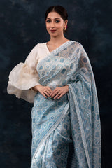 Sparkling Blue Geometrical Printed Embellished Tissue Silk Saree