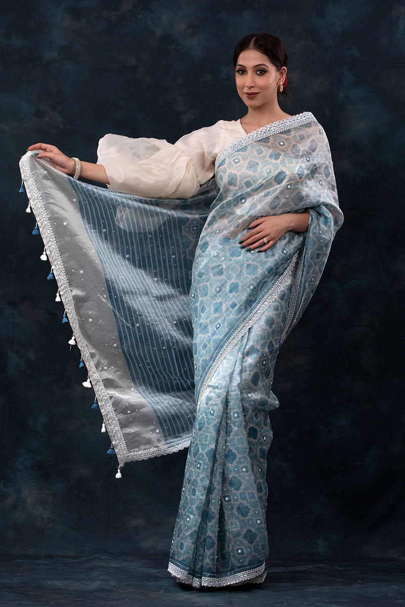 Sparkling Blue Geometrical Printed Embellished Tissue Silk Saree