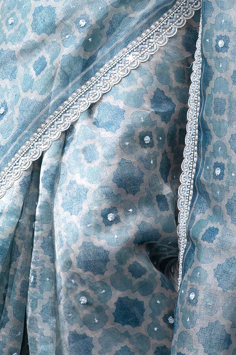 Sparkling Blue Geometrical Printed Embellished Tissue Silk Saree