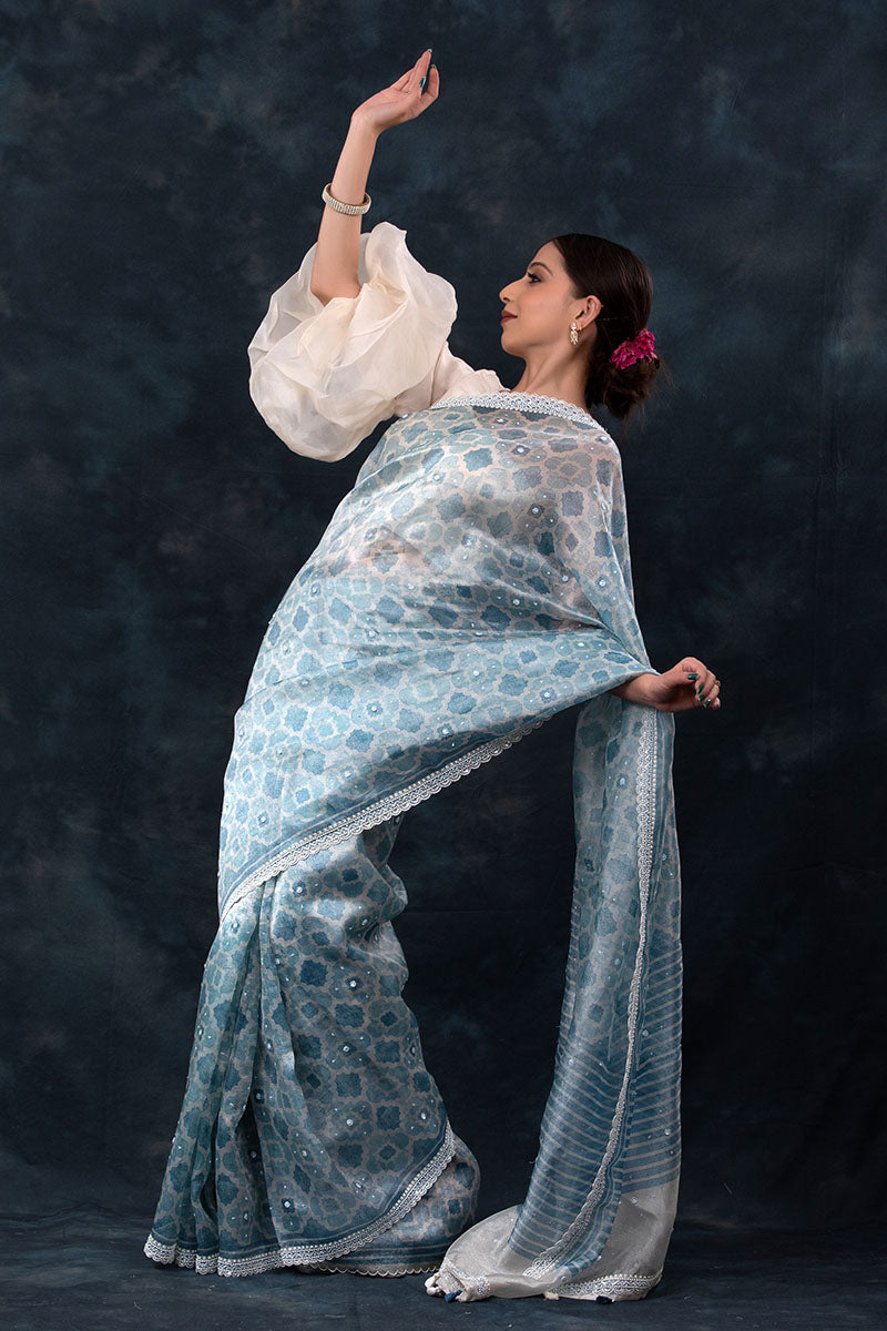 Sparkling Blue Geometrical Printed Embellished Tissue Silk Saree