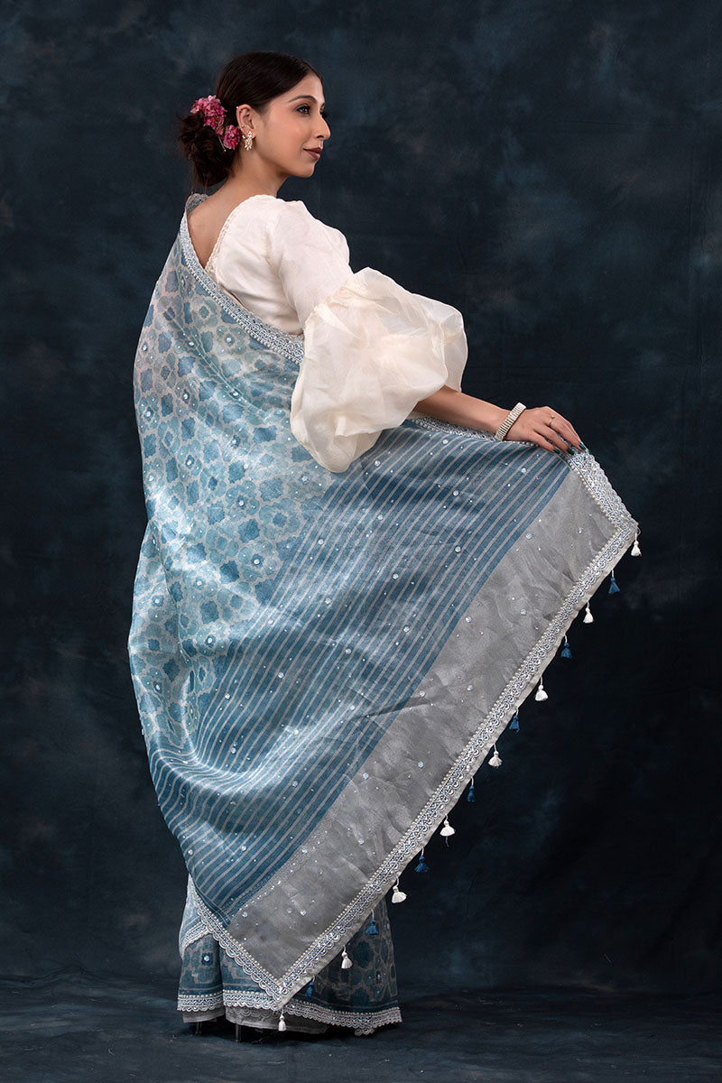 Sparkling Blue Geometrical Printed Embellished Tissue Silk Saree