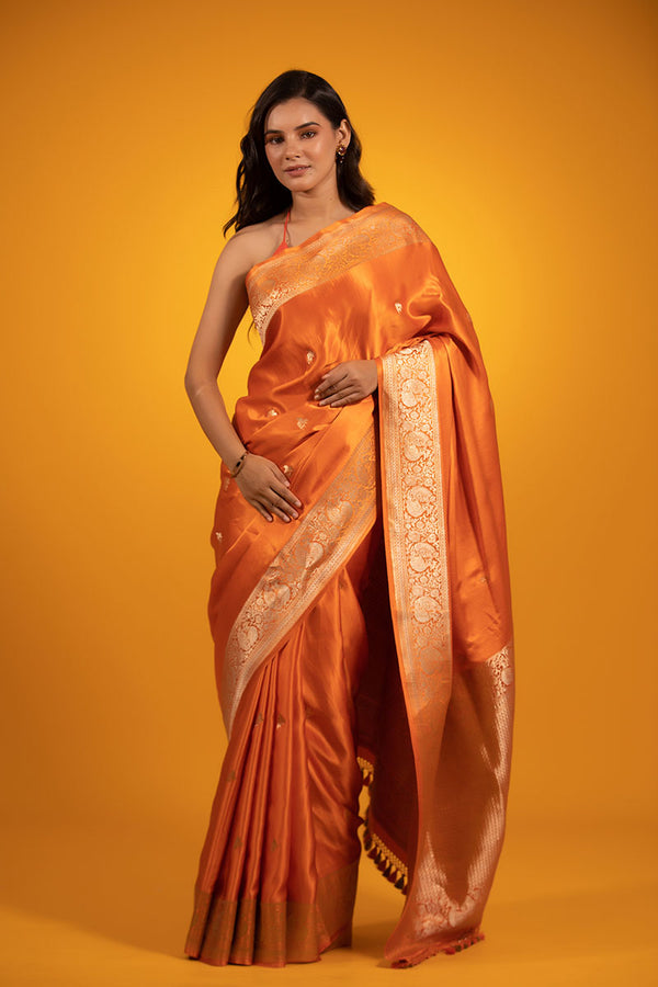 Women In Coral Handwoven Banarasi Satin Silk Saree At Chinaya Banaras